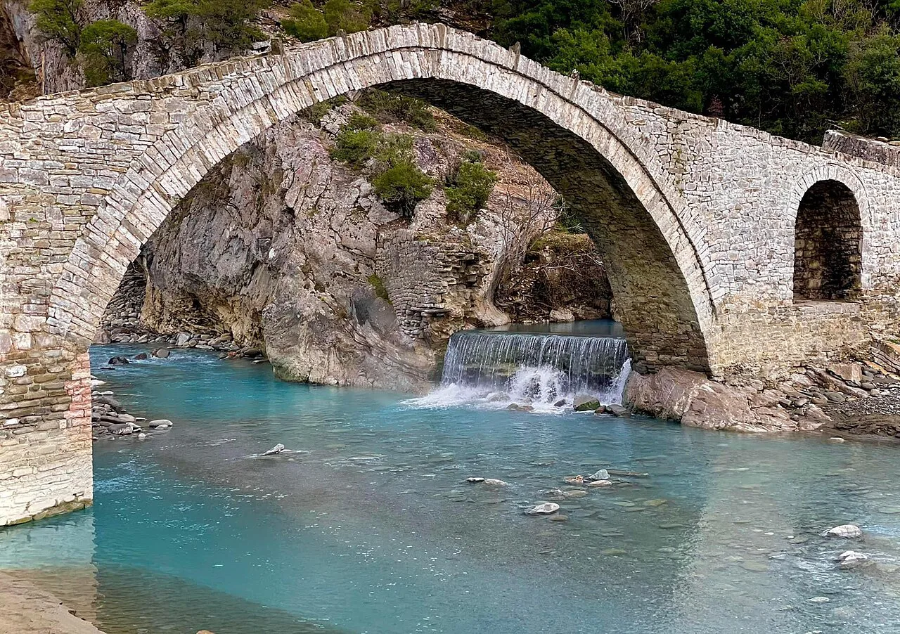 The Ottoman-era Kati Bridge arching over clear turquoise water.