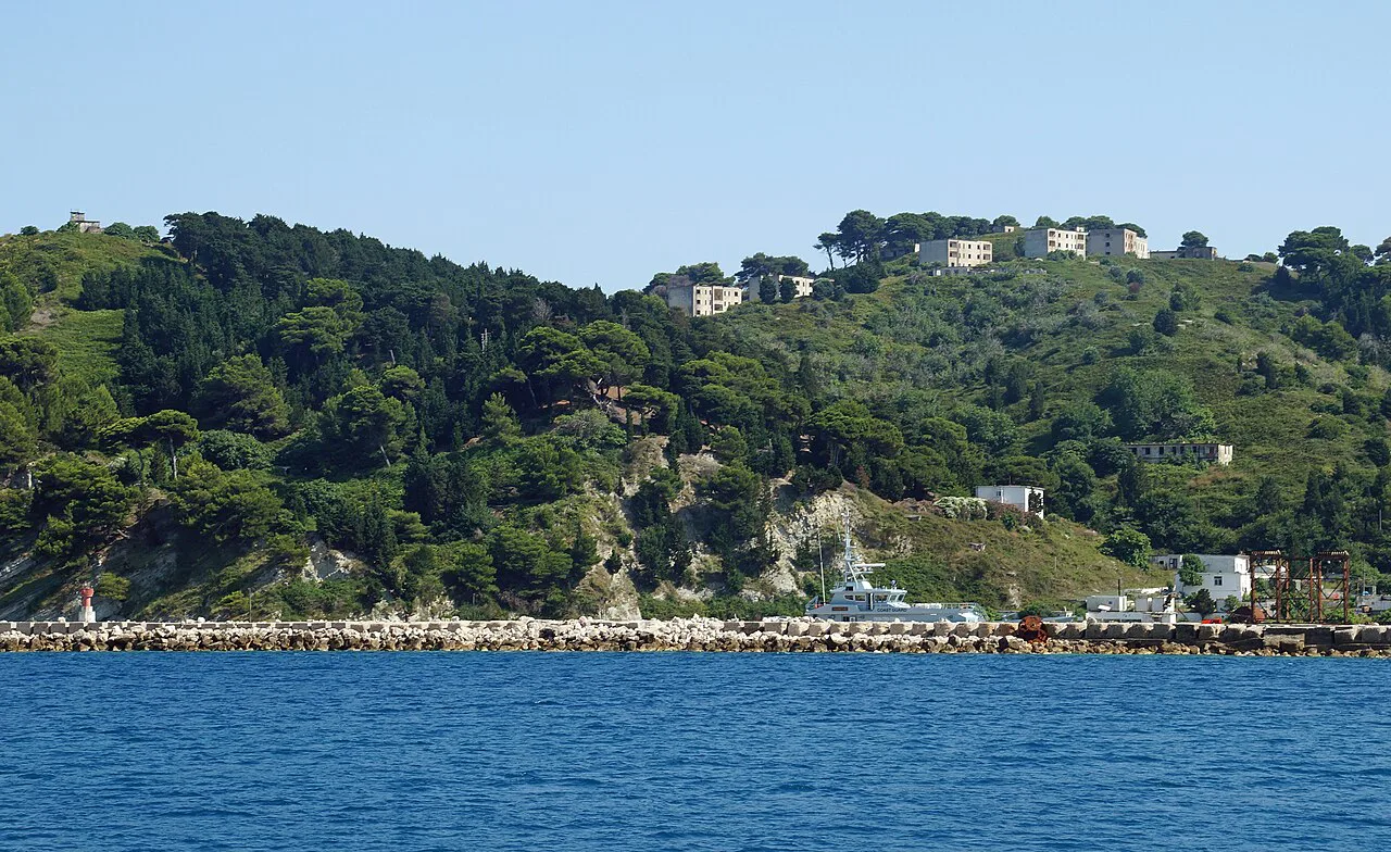 The port and old buildings on Sazan Island.
