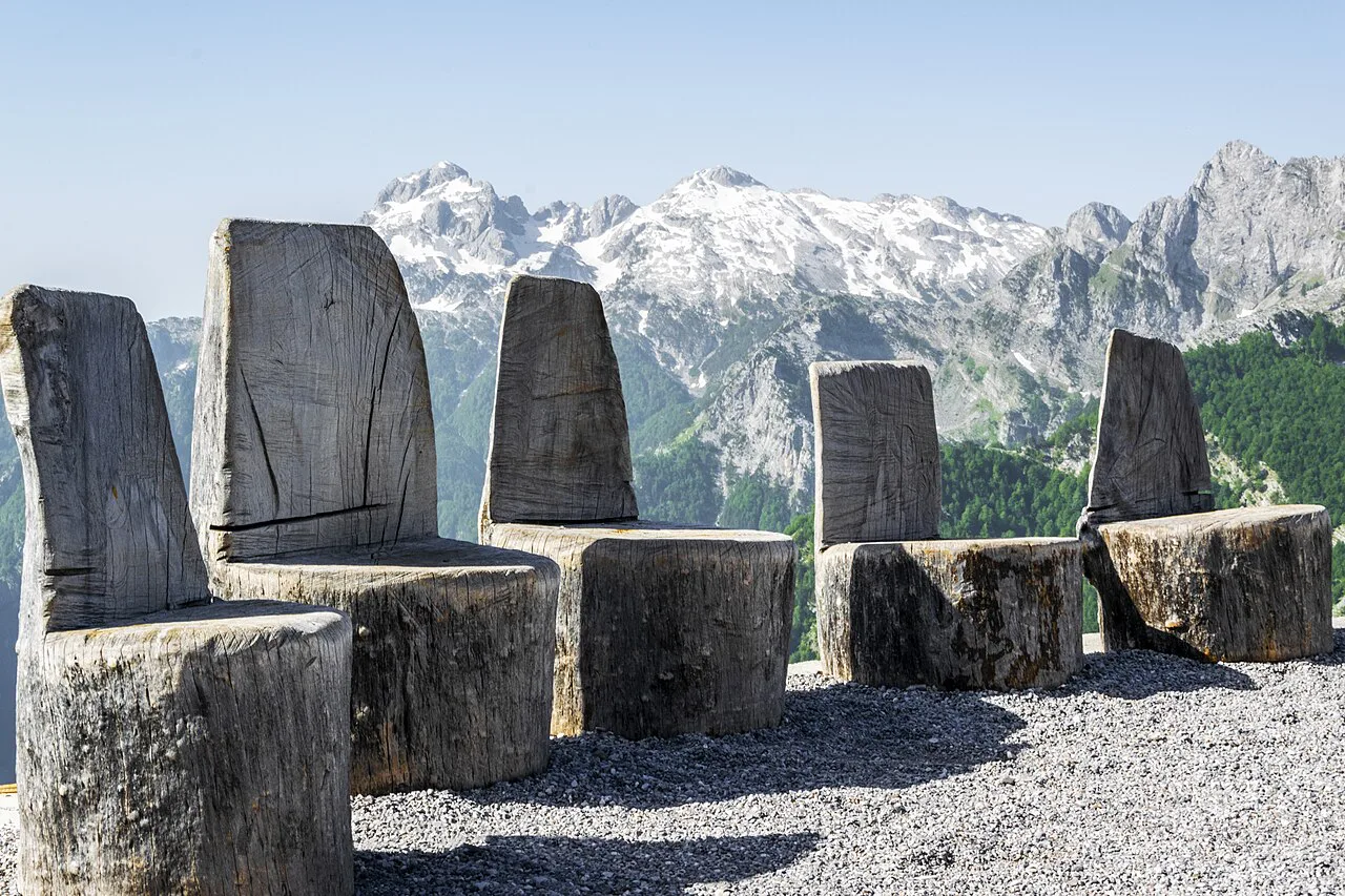 Wooden seats facing the peaks of the Albanian Alps near Theth.