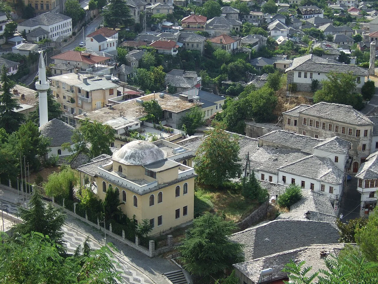 Stone-roofed houses and a mosque in Gjirokastër.