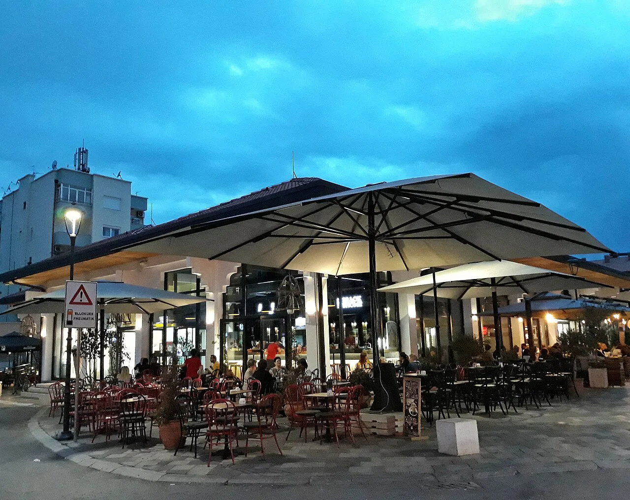A café terrace with outdoor seating in Tirana.