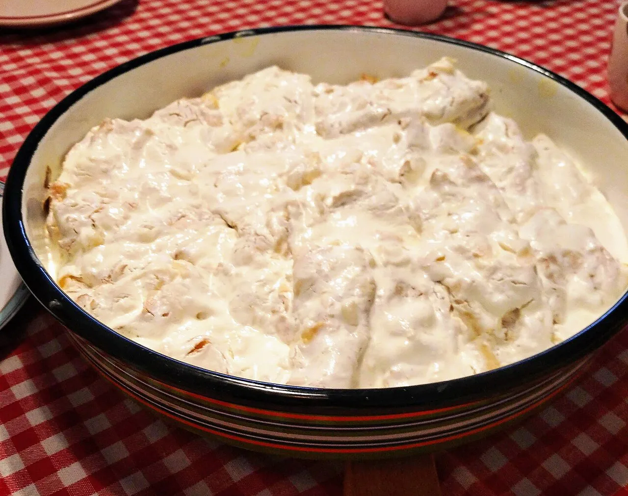 Bakllasarëm, an Albanian pie dish topped with garlicky sour cream.