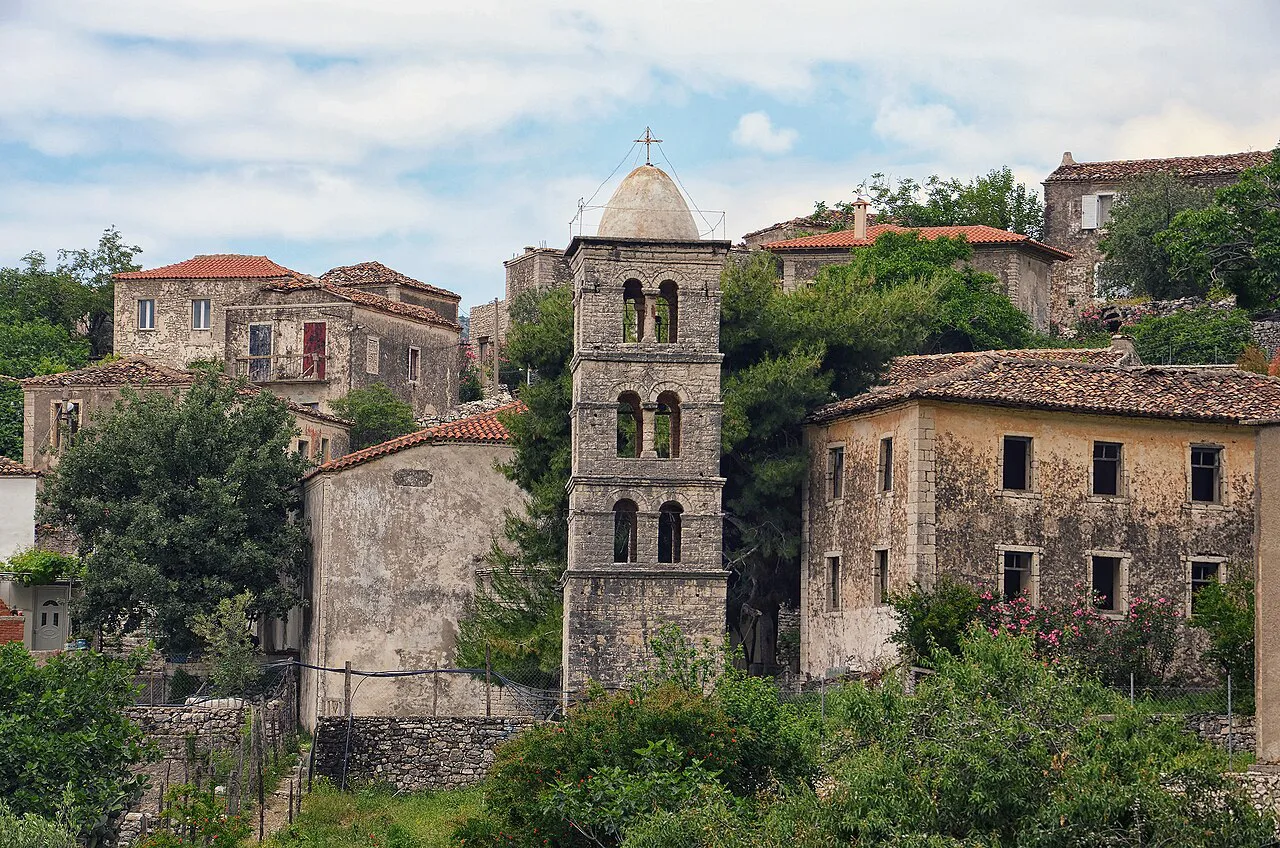 Stone houses and a bell tower in the old village of Qeparo, near Himarë.