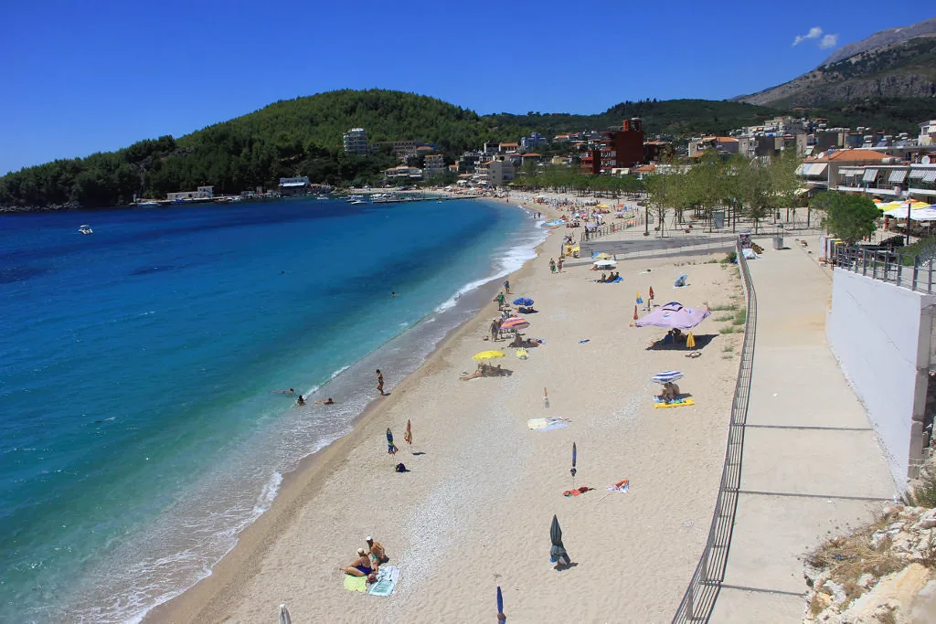 The curving sandy beach at Himarë on the Albanian Riviera.