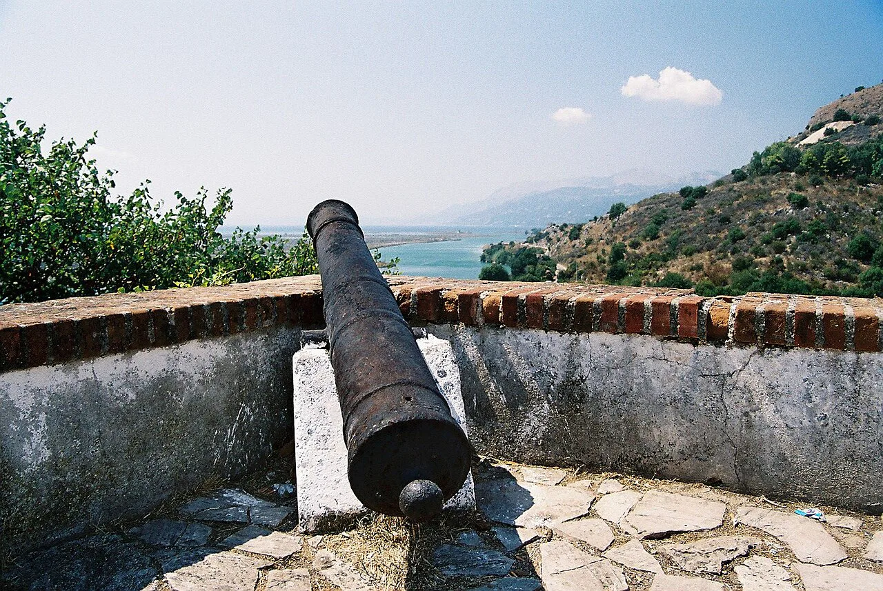 An old cannon overlooking the Vivari Channel at Butrint, towards Ali Pasha's fort.