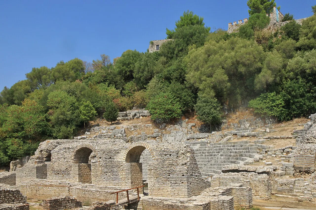 Stone arches of the theatre and fortress walls at Butrint.