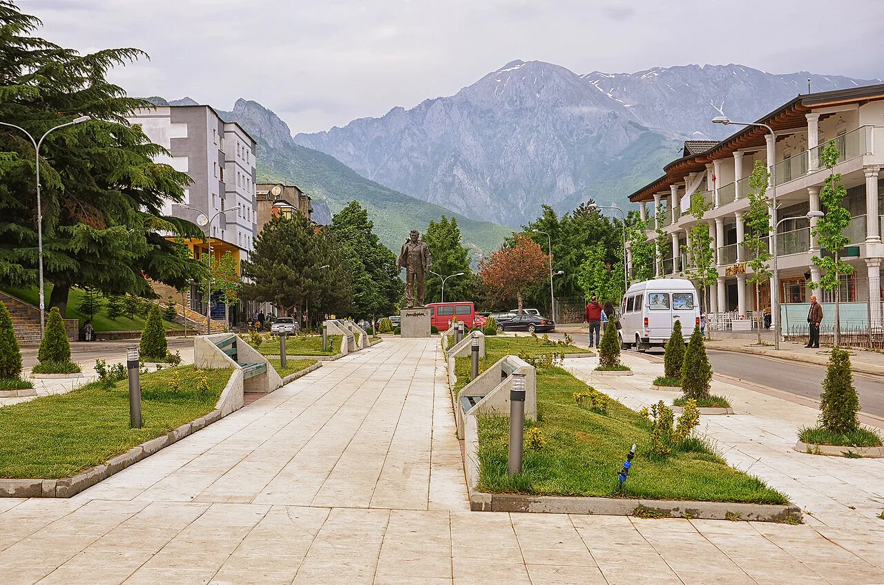 Azem Hajdari Square in Bajram Curri with mountains behind.