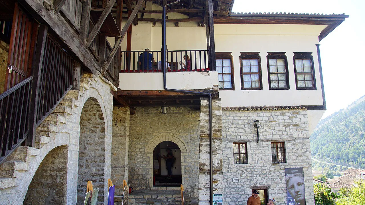 The stone-and-timber courtyard of the Ethnographic Museum in Berat.