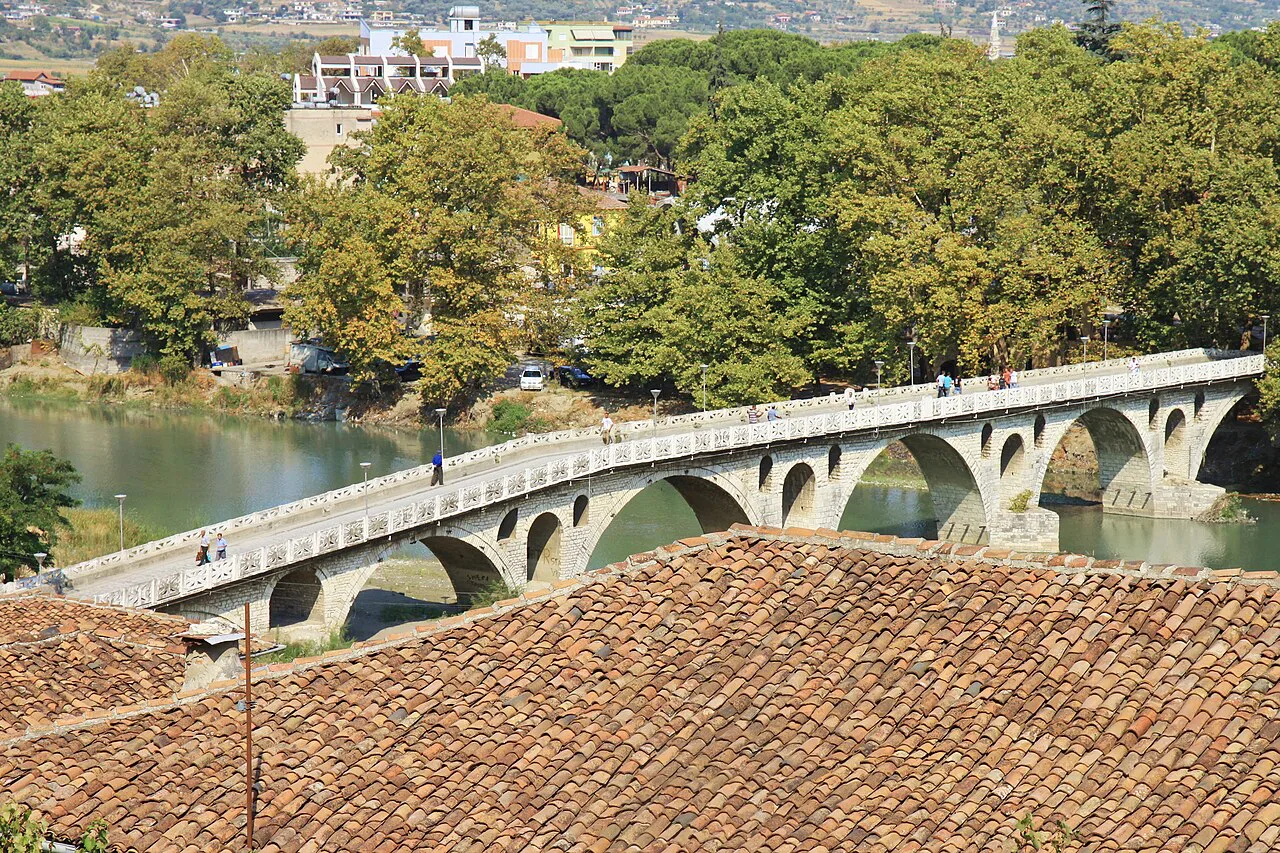 The Gorica Bridge over the Osum river, seen over the rooftops of Berat.