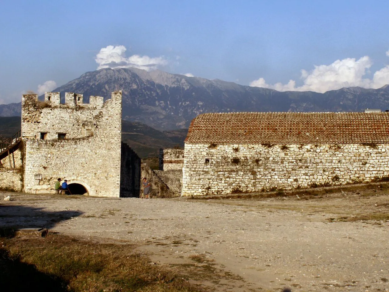 A medieval tower and stone buildings in Berat's castle quarter.