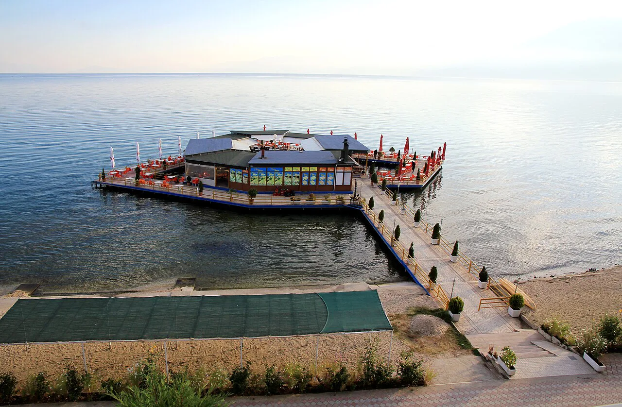 A pier leading to a lakeside restaurant on Lake Ohrid in Pogradec.