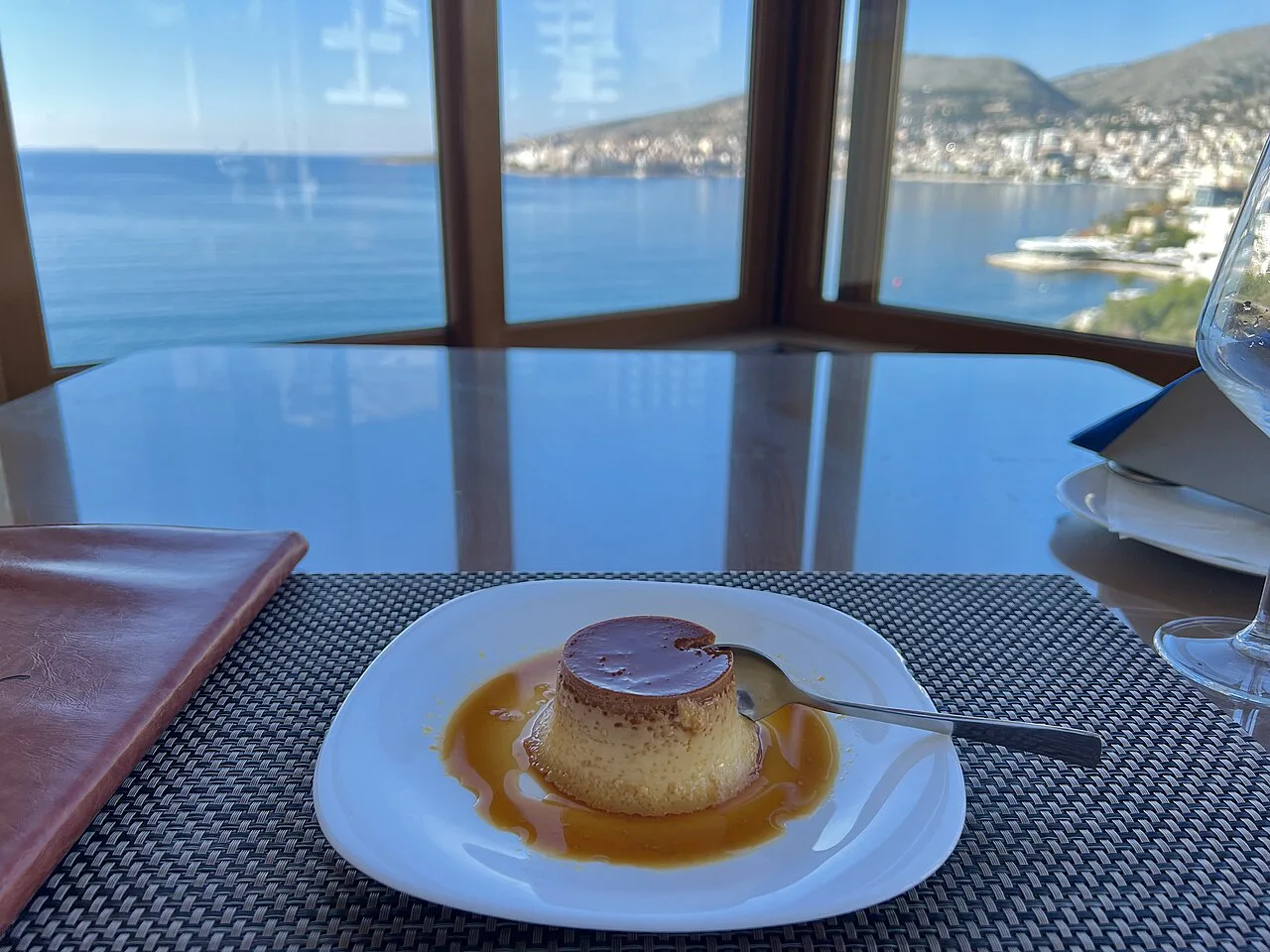 A dessert at a window table overlooking the bay in Sarandë.