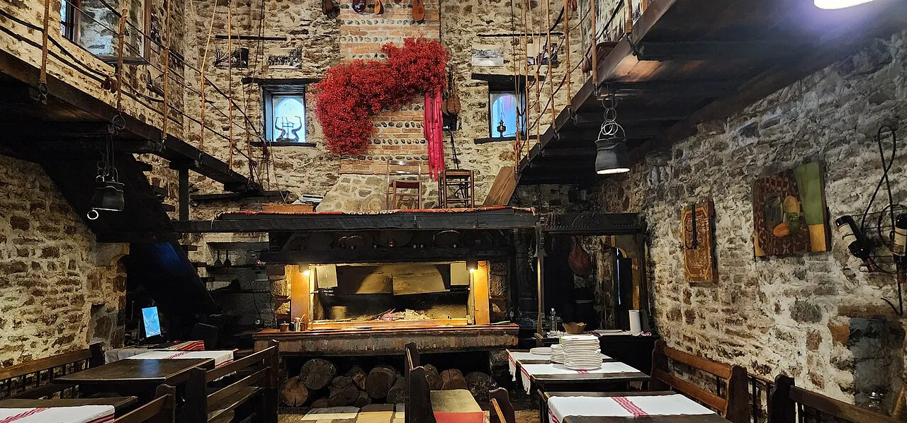 The stone-walled dining room of Hotel Tradita in Shkodër.