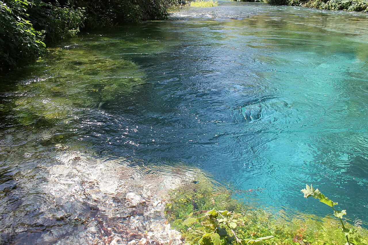 The deep turquoise water of the Blue Eye spring.
