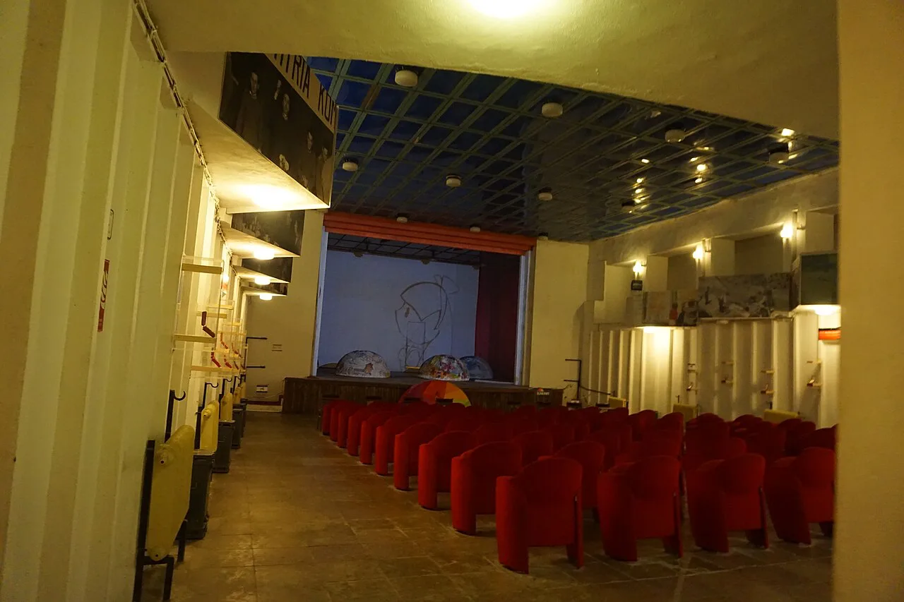 The assembly hall with rows of red seats inside Bunk'Art 1 in Tirana.