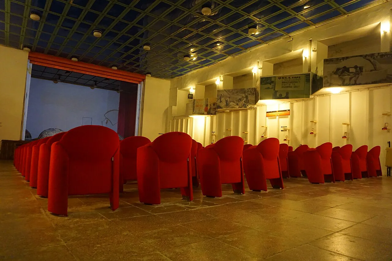 The assembly hall with rows of red seats inside Bunk'Art 1 in Tirana.