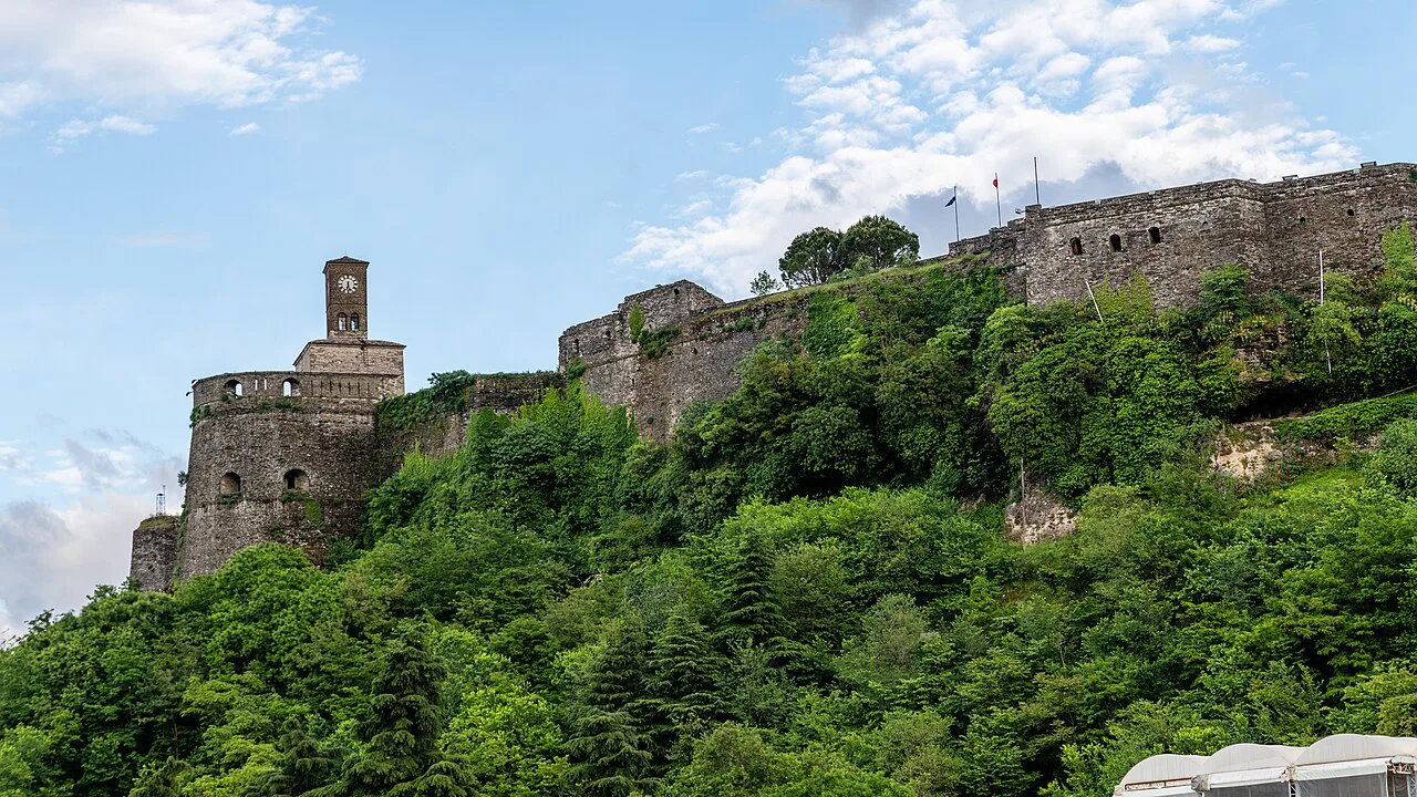 Gjirokastër Castle rising above the green hillside.