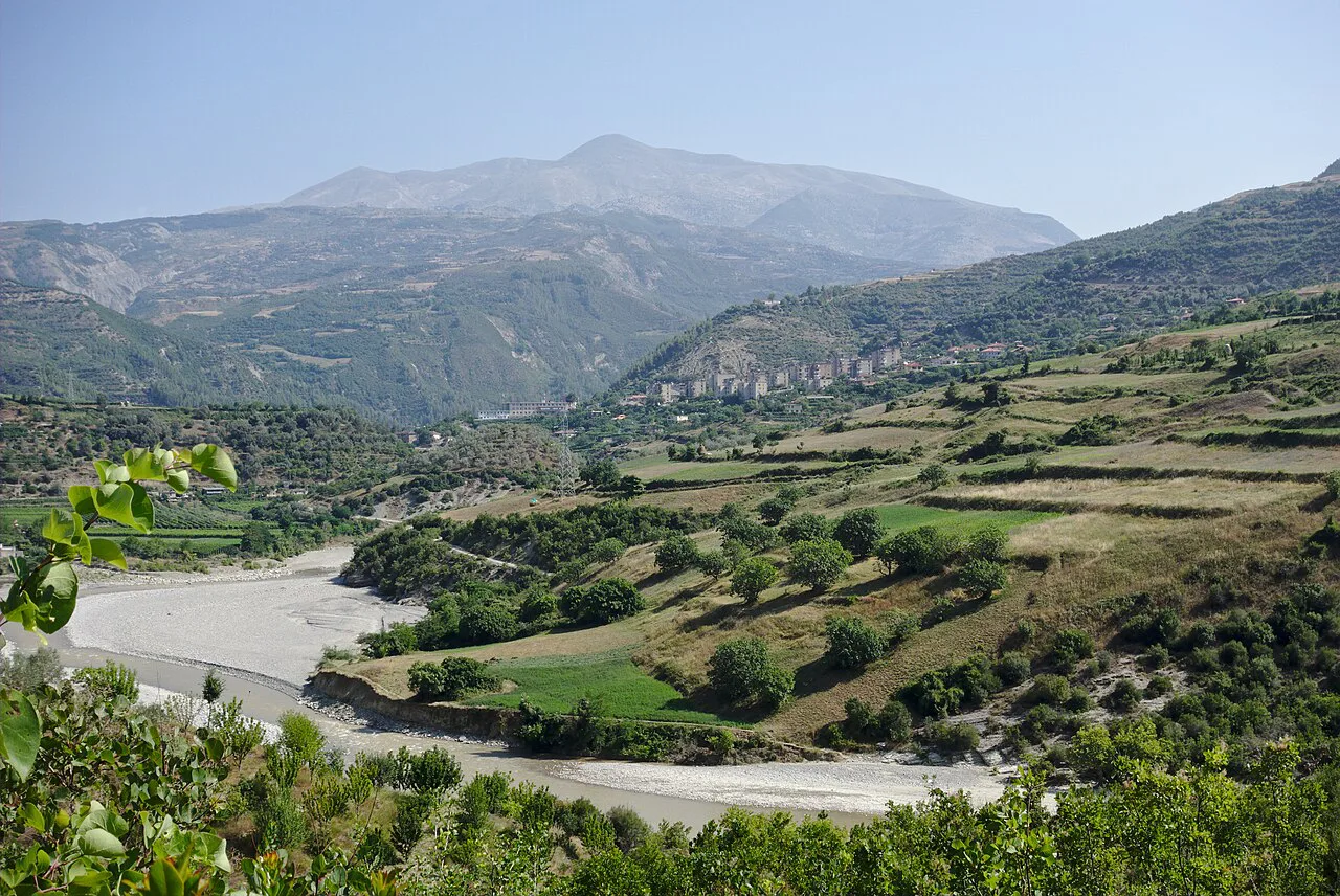 Terraced hills and the riverbed in the valley around Çorovodë.