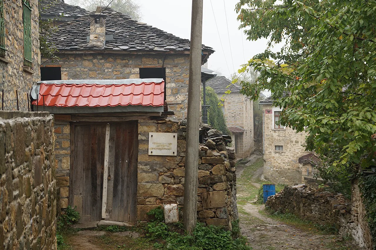 An alley lined with traditional stone houses in Dardha.