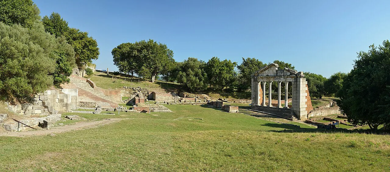 Ruins and the restored Bouleuterion facade at ancient Apollonia near Fier.