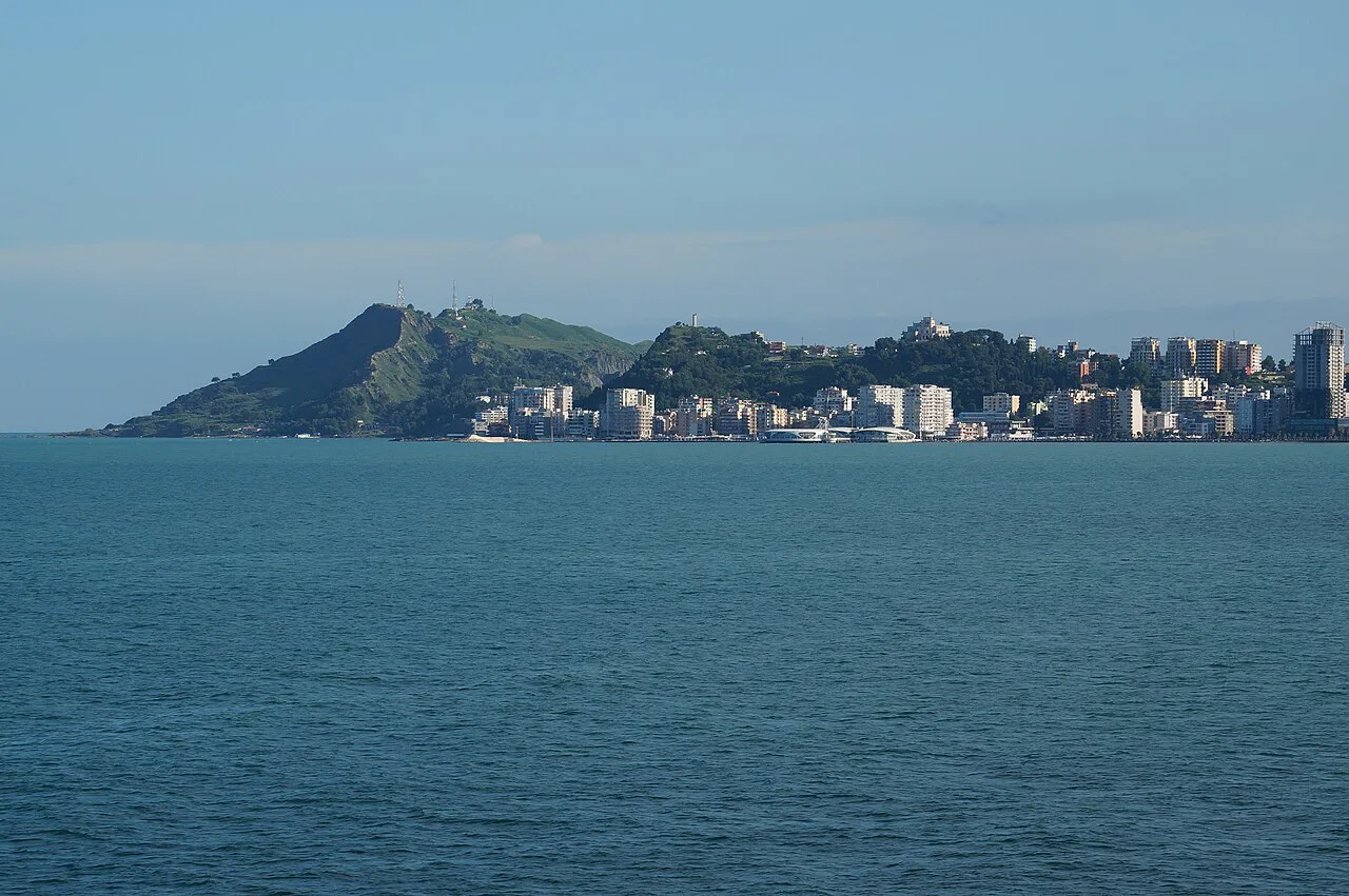 Durrës seen from the sea, with its hillside and seafront buildings.