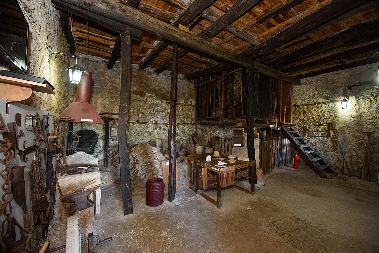 A timber-framed workroom with old tools in the Ethnographic Museum of Krujë.