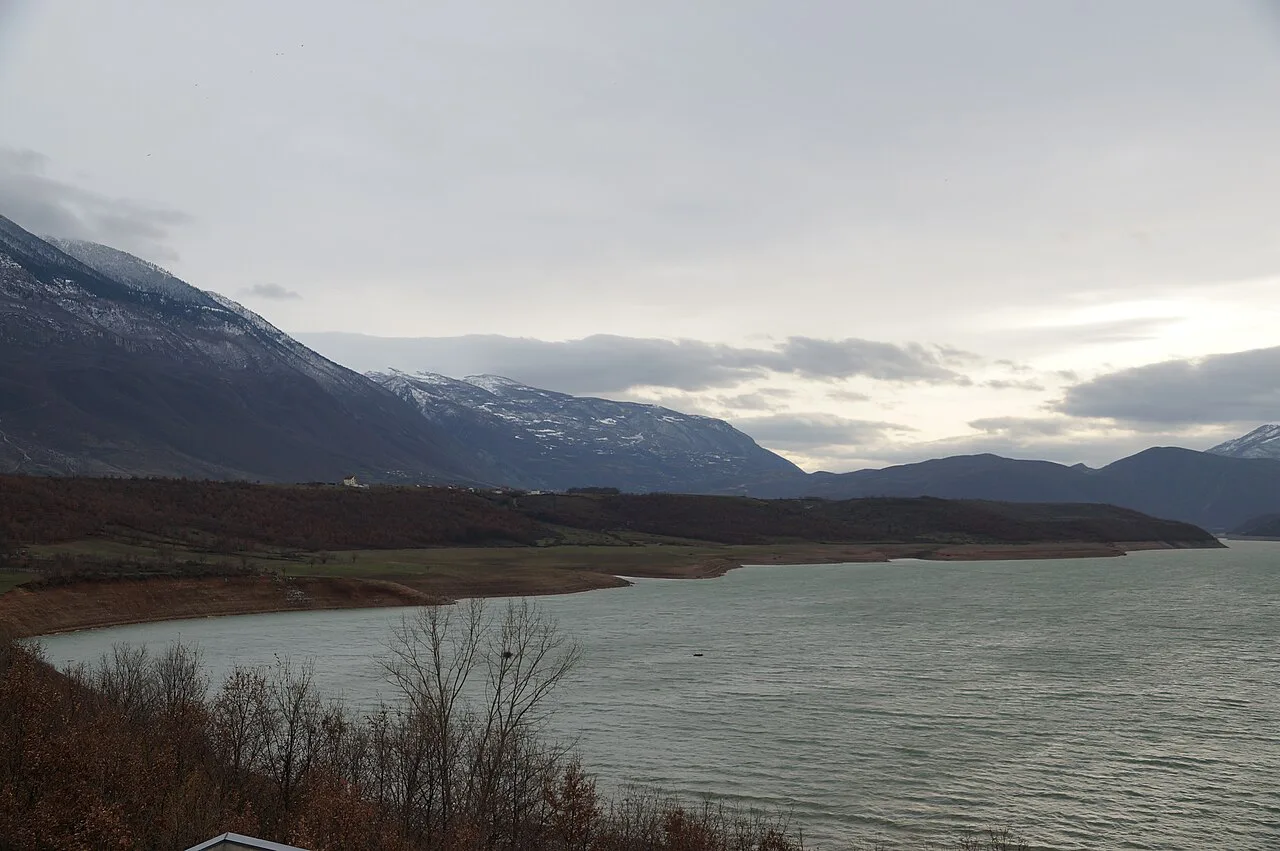 Lake Fierza near Kukës beneath snow-dusted mountains.