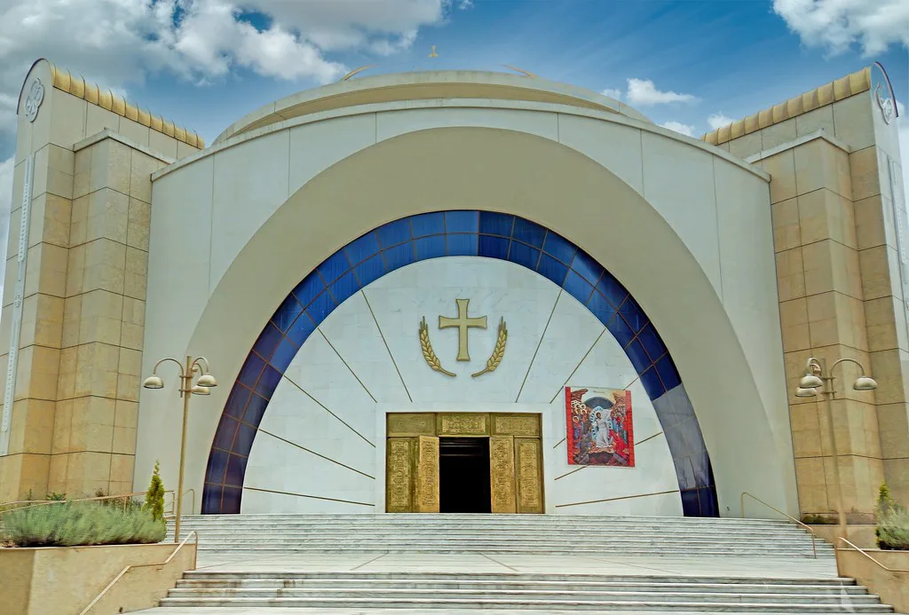 The arched facade of the Resurrection of Christ Orthodox Cathedral in Tirana.