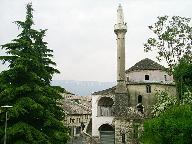 A mosque and minaret in the old town of Gjirokastër.