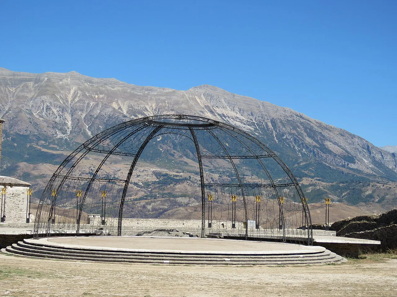 The festival stage inside Gjirokastër Castle, with mountains behind.