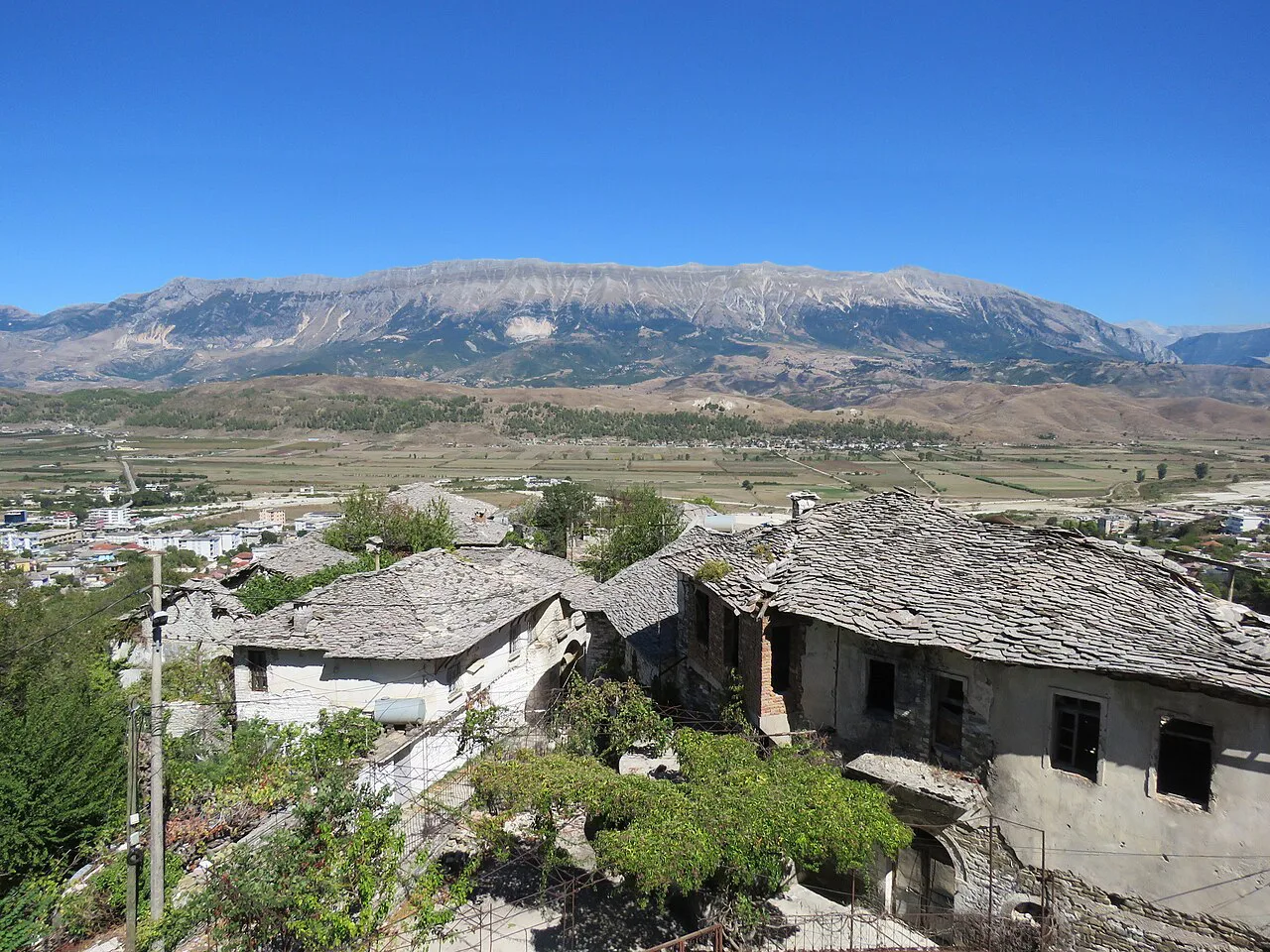 Stone-roofed houses in Gjirokastër above the Drino Valley.