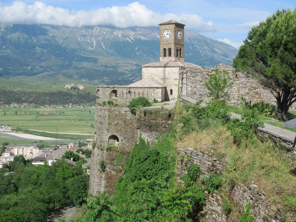 The clock tower at the north-east corner of Gjirokastër Castle, above the valley.