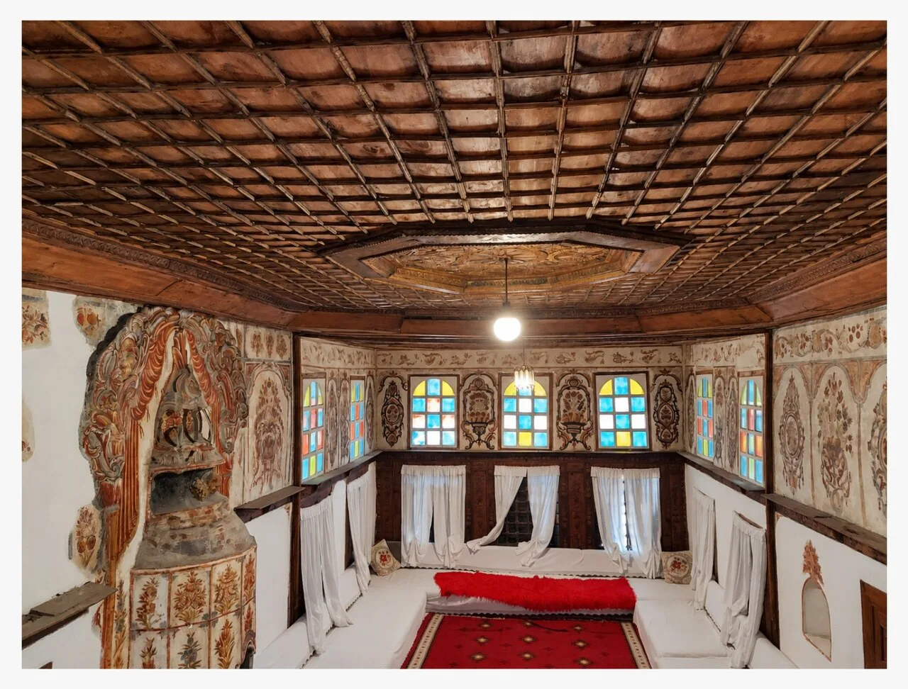 The Great Room with its carved wooden ceiling in Zekate House, Gjirokastër.