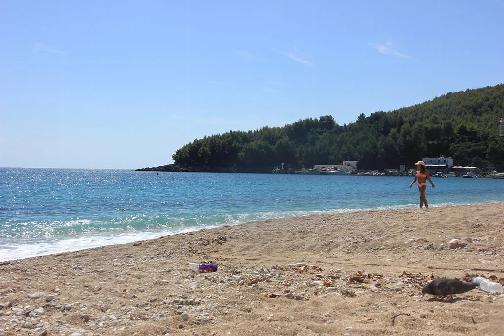 A quiet pebble beach and calm sea at Himarë.