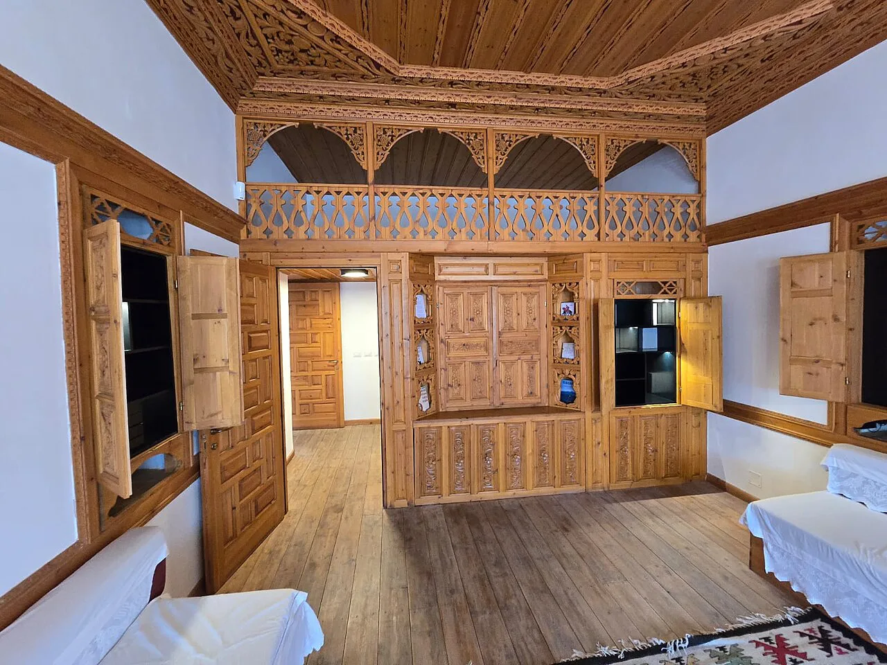 A wood-panelled room in the Ismail Kadare House, Gjirokastër.