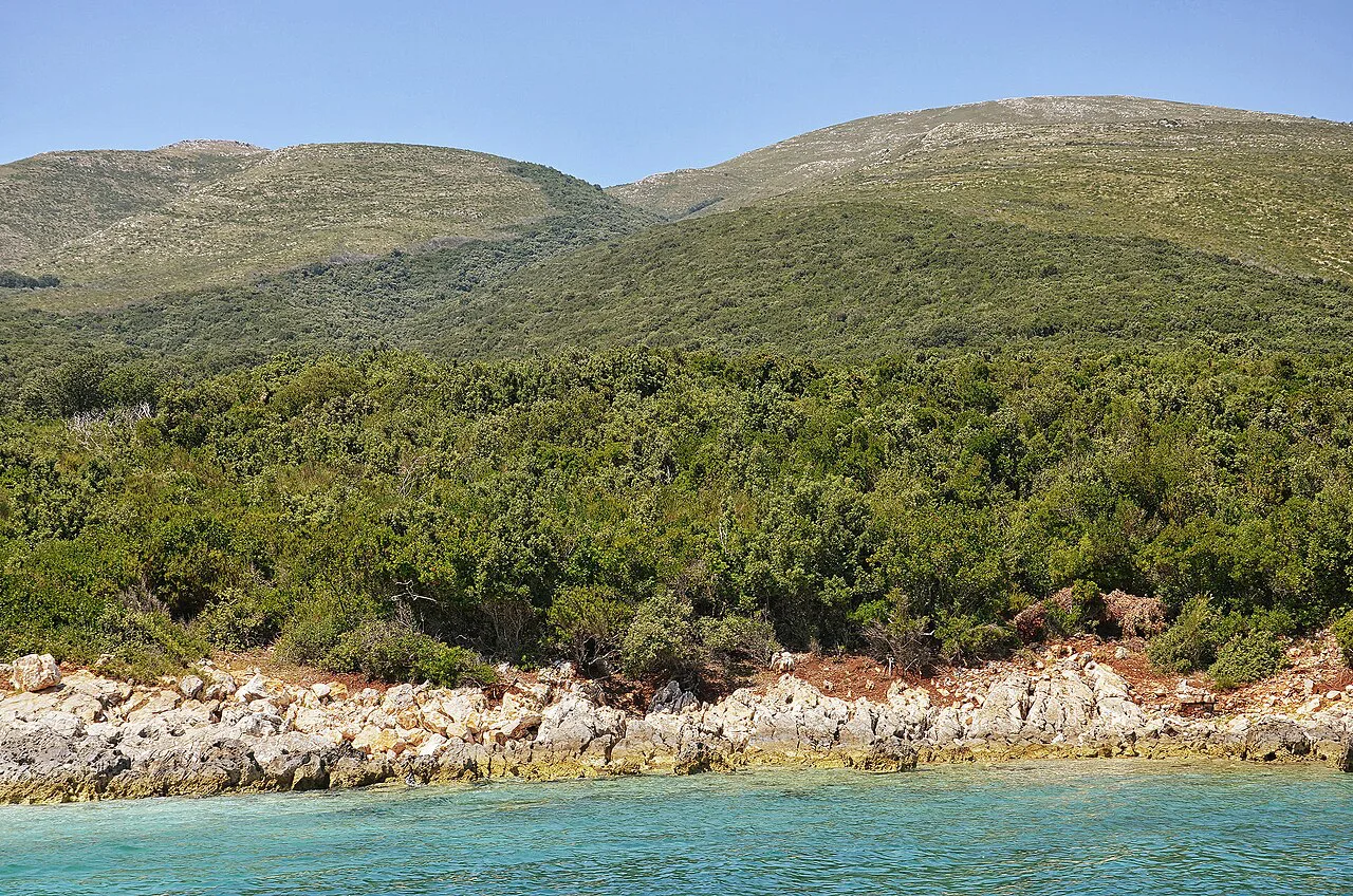 Rocky shoreline below the hills of the Karaburun Peninsula.
