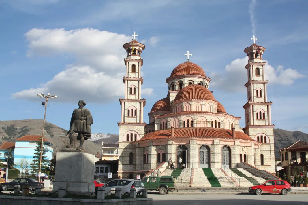 Korçë Cathedral with a statue in the square in front.