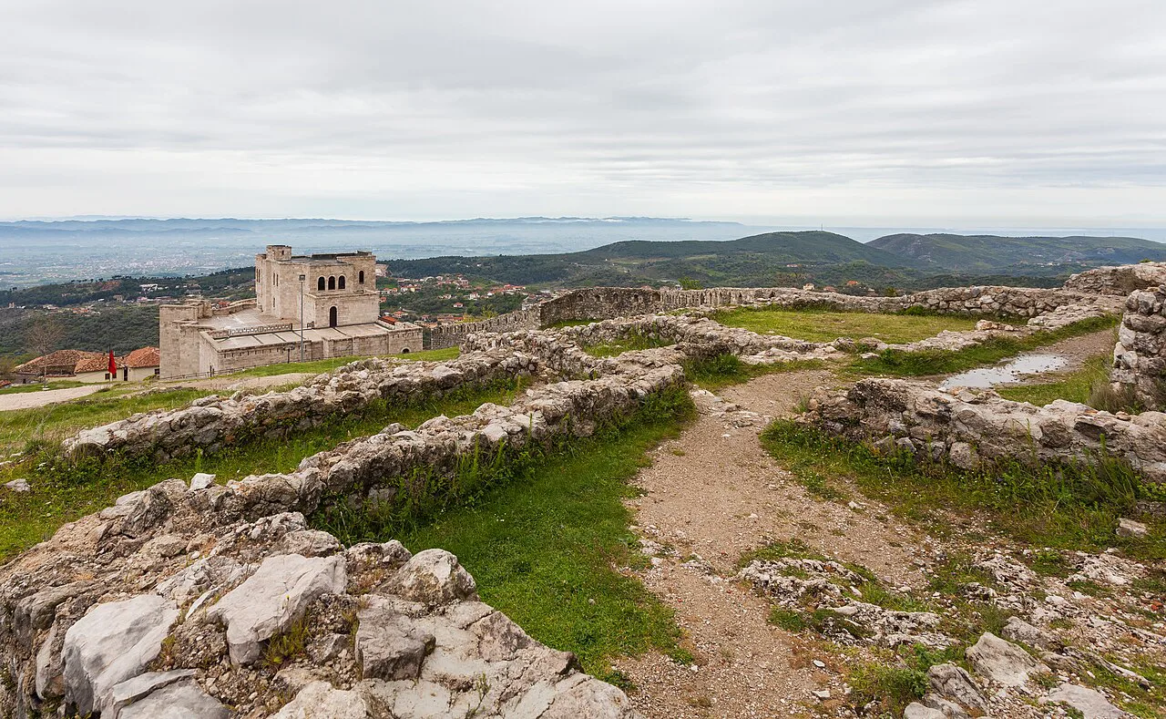 The ruined walls of Krujë Castle with views towards the coast.