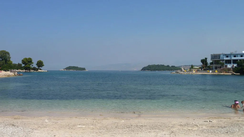 A sandy beach at Ksamil looking out to the small offshore islands.