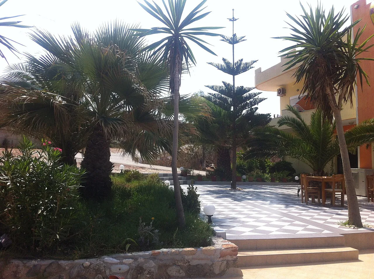 A palm-shaded square in Ksamil.