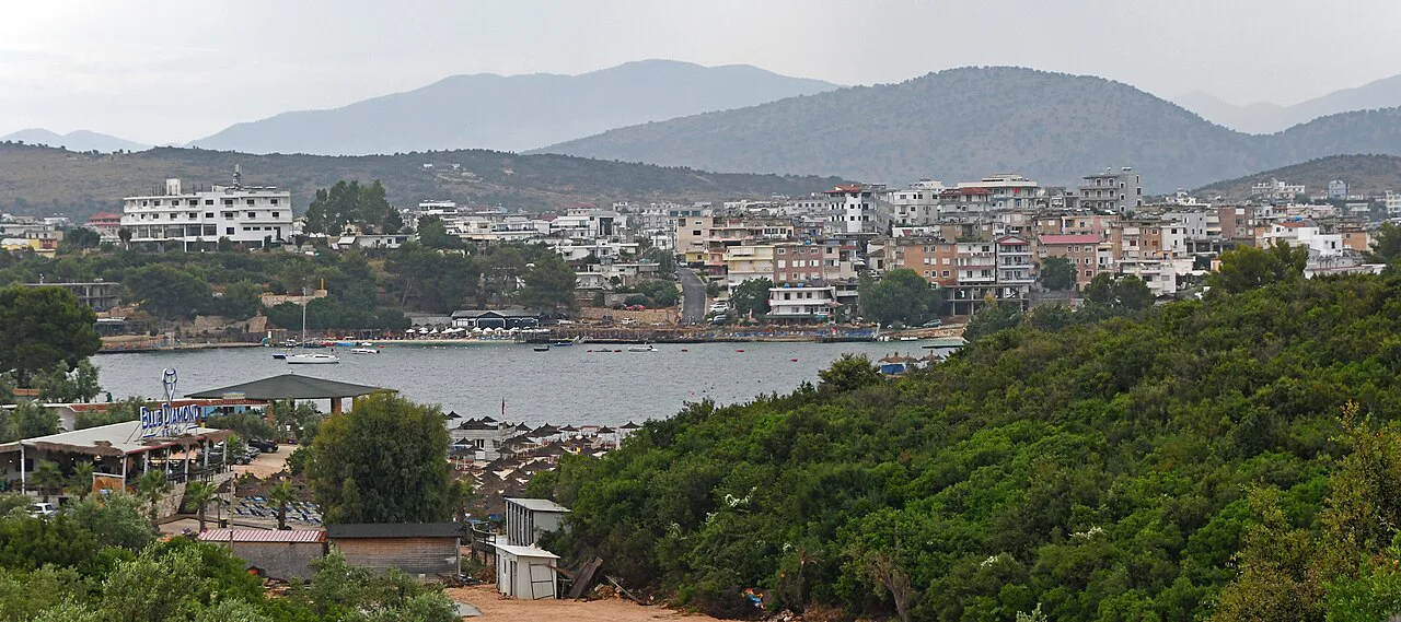 Ksamil town and its bay with mountains in the distance.
