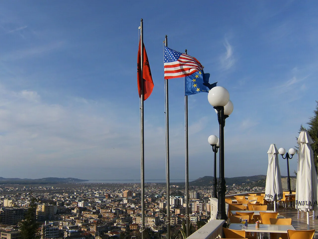 Flags on the Kuzum Baba terrace above Vlorë, looking out over the city.