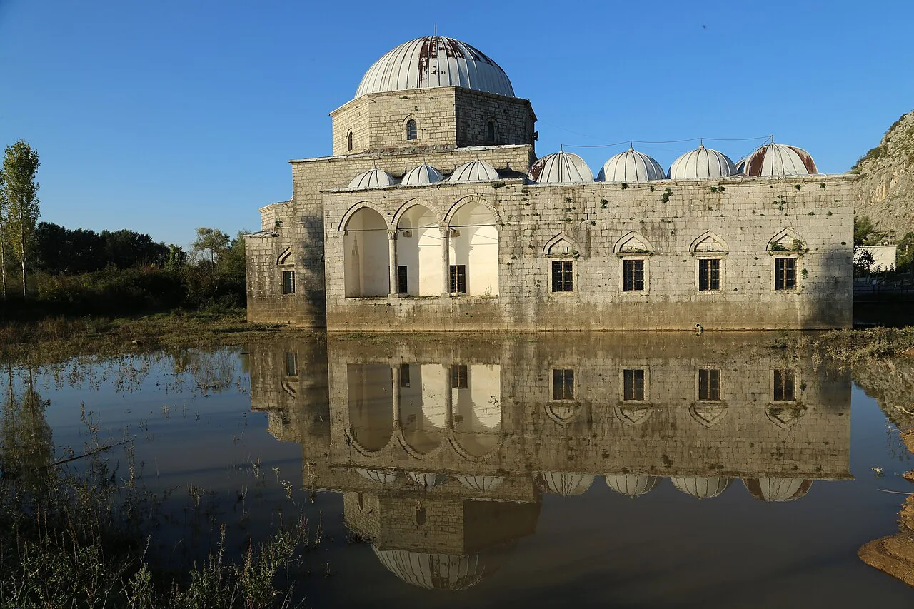 The Lead Mosque in Shkodër reflected in the surrounding water.