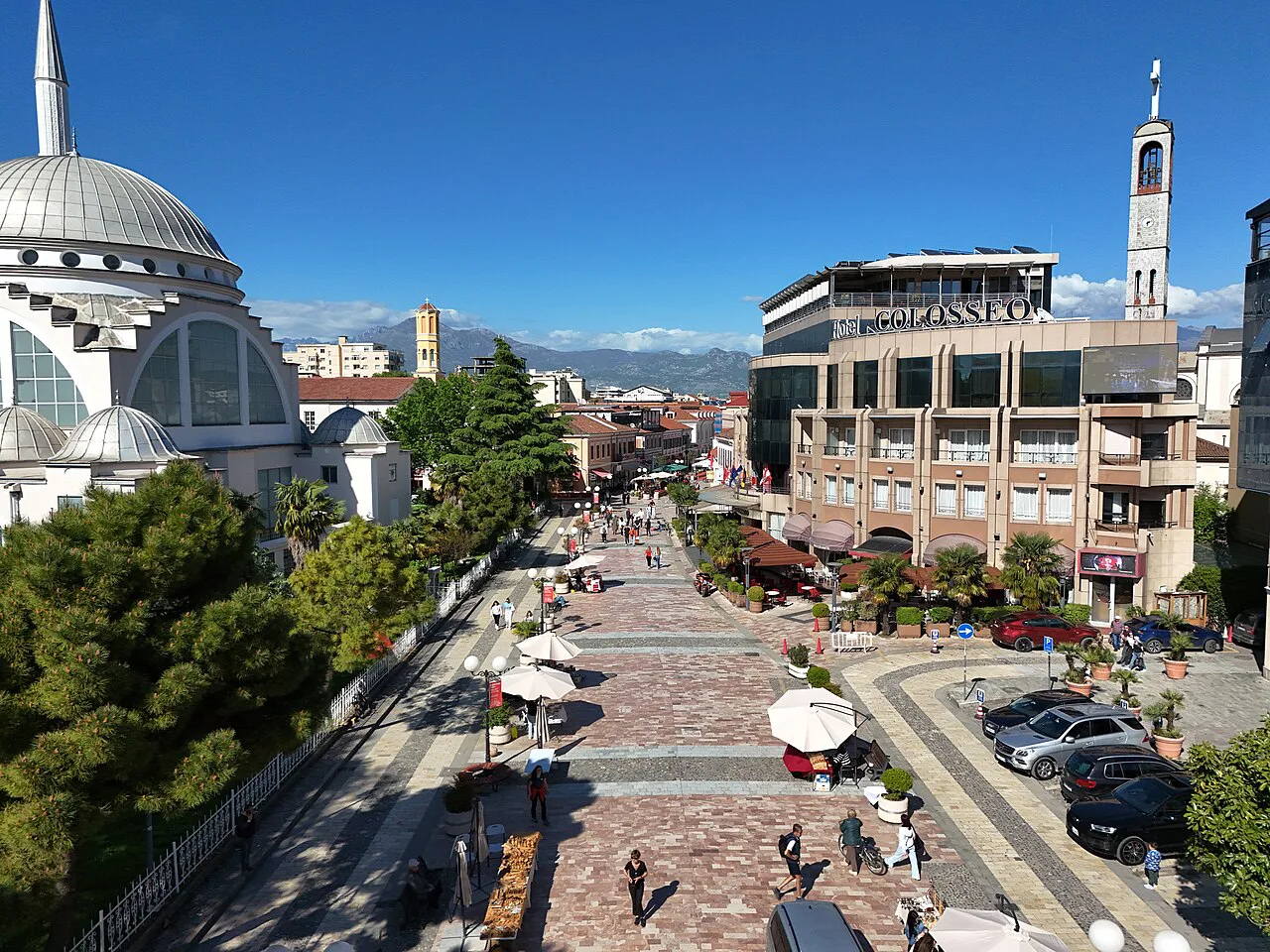Kolë Idromeno Street in Shkodër, with a large domed mosque on the left.