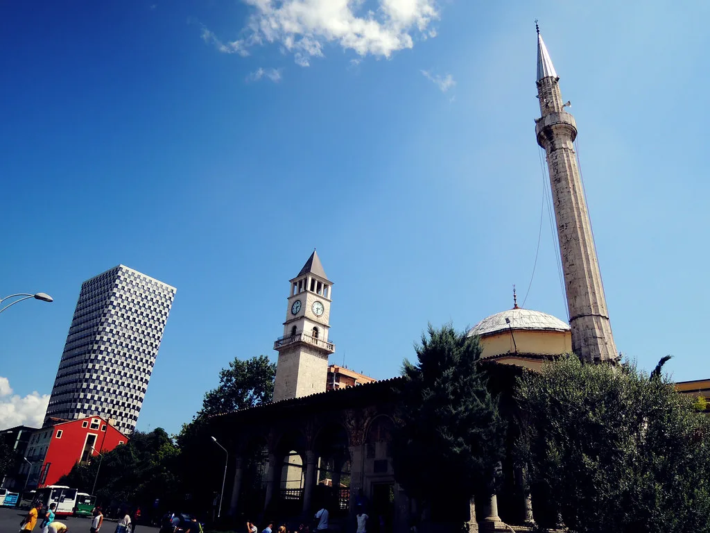The minaret of the Et'hem Bey Mosque beside the clock tower in Tirana.