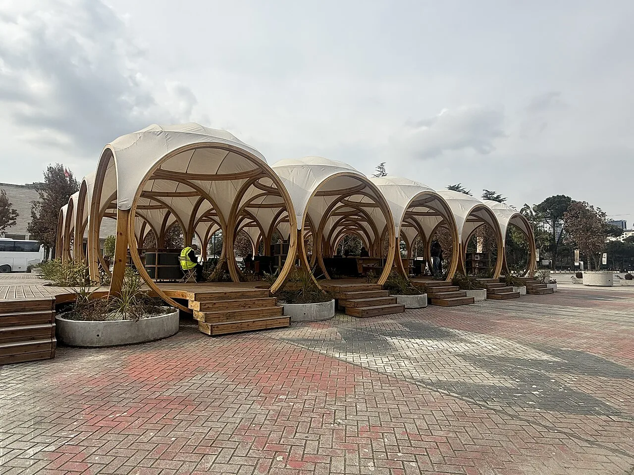 The open-air reading pavilions of the public library on Mother Teresa Square.