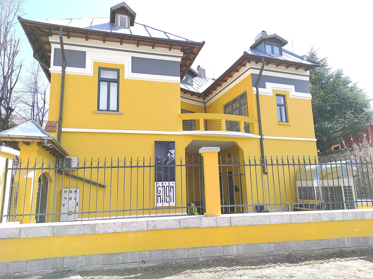 The yellow building of the Gjon Mili museum in Korçë.