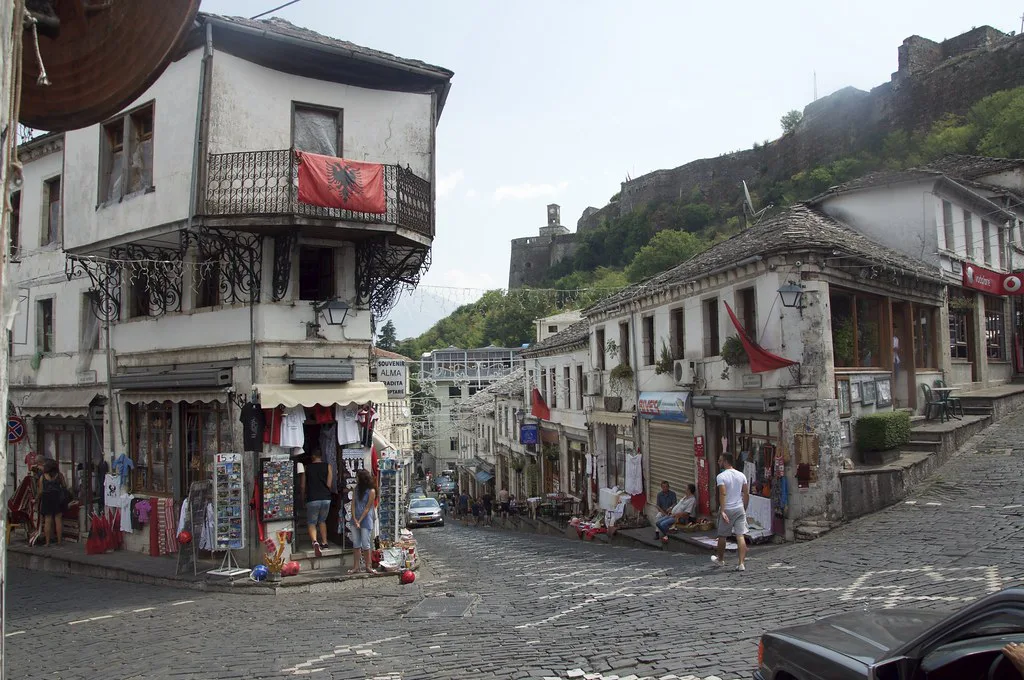 Shops at a junction in Gjirokastër's old bazaar, with the castle above.