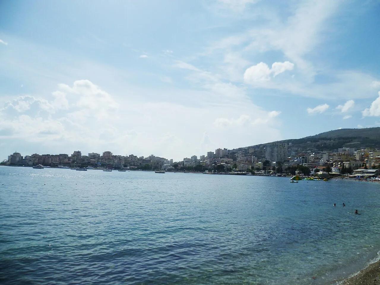 The seaside at Sarandë with the town along the bay.