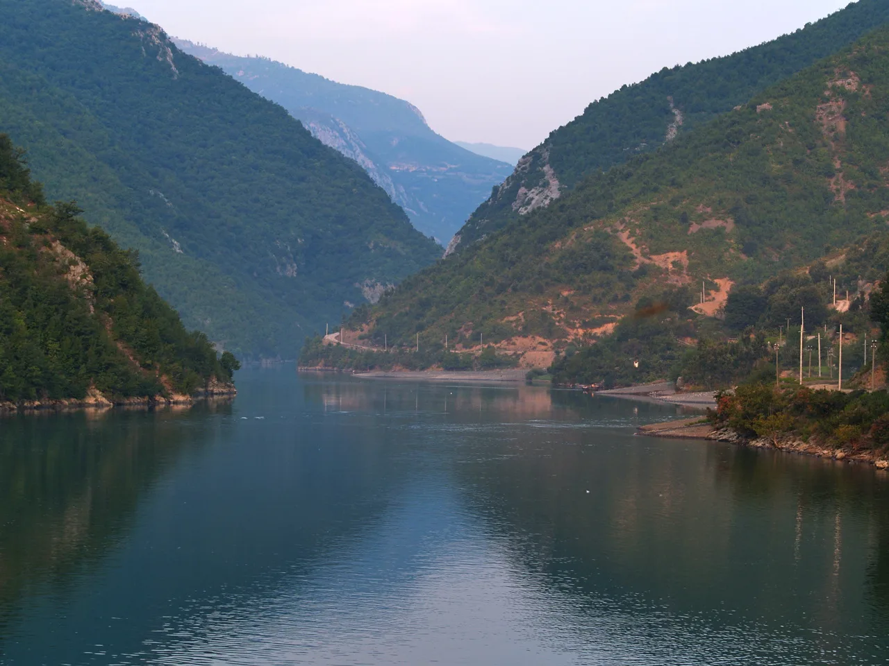 Early morning on Lake Koman, the reservoir reached on boat trips from Shkodër.
